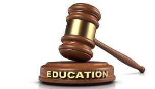Gavel and "EDUCATION" word writing on sound block.