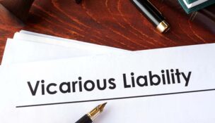 A piece of paper that reads "Vicarious liability" that's on a table