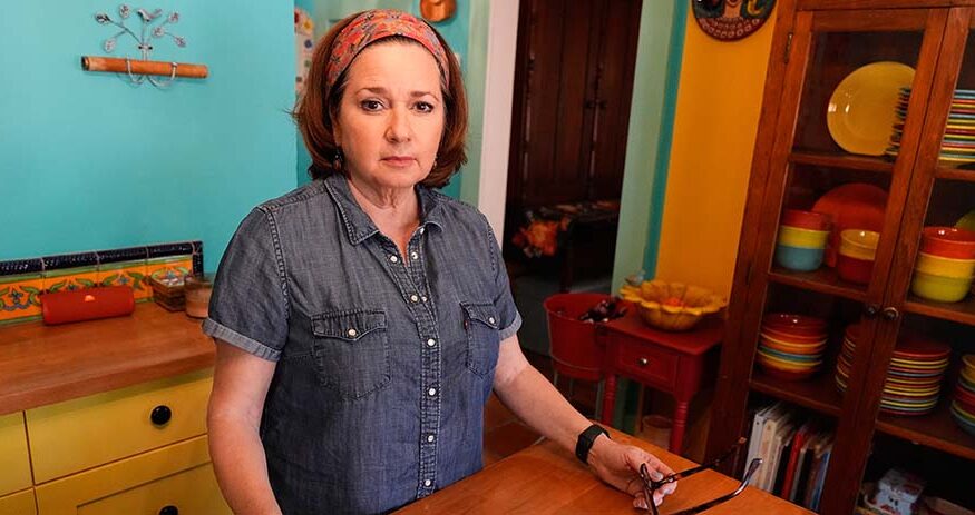 Gigi Cervantes poses for a photo at her home