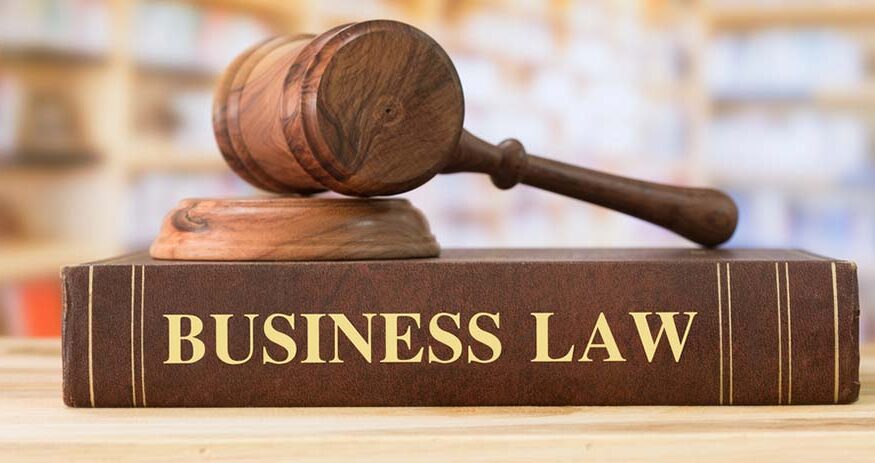 Business Law books with a judges gavel on desk in the library. Law education ,law books concept.
