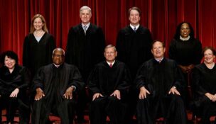 U.S. Supreme Court justices pose for their group portrait at the Supreme Court