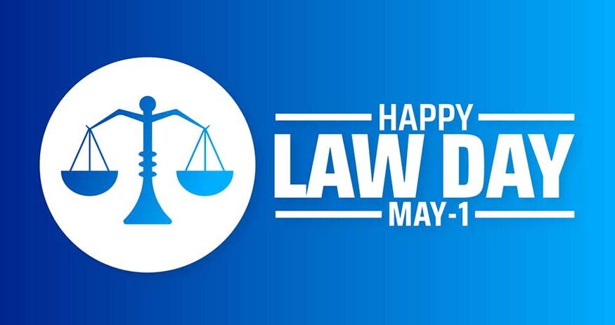 A graphic with scales of justice and the words HAPPY LAW DAY MAY 1