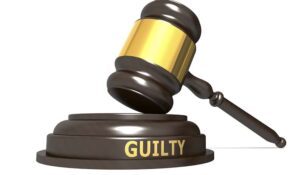 Wooden judge gavel with guilty word, 3d rendering