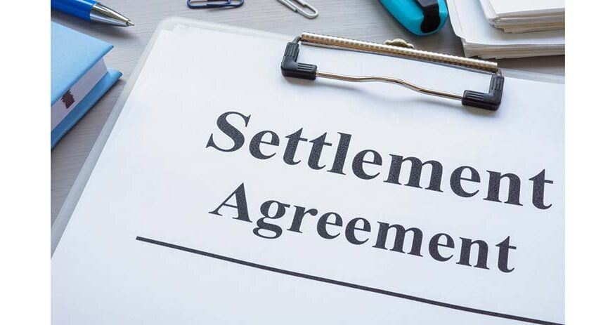 Close-up of clipboard with settlement agreement