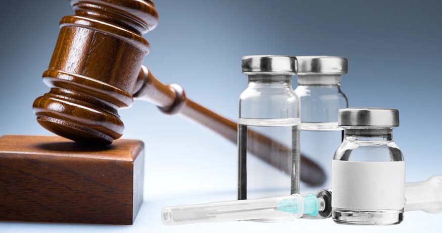 Small vials with liquid in them next to a gavel